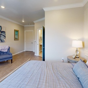 Make this space your own a bedroom with a bed and a chair