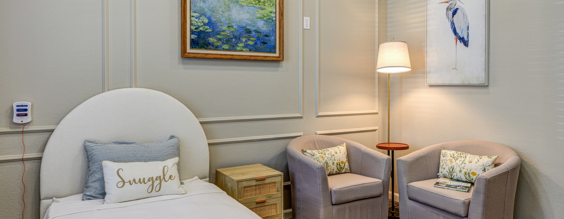 Cozy bedroom with chairs, bed, and nightstand
